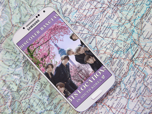 White samsung phone with e-book Discover Bangtan bts locations