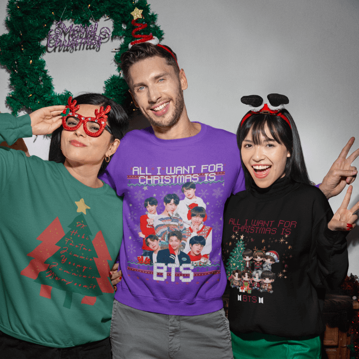 Group of people wearing BTS fun (ugly) christmas sweaters