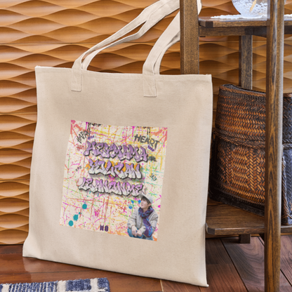 Woman holding natural canvas totebag with grafitti style Hey mama lyrics J-hope of BTS