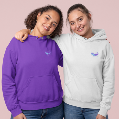 Two women wearing Whalien 52-inspired BTS hoodies in purple and white with a whale design.