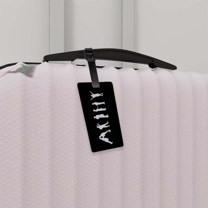 Leftside of a travel suitcase and luggage tag with ARMY sign of BTS