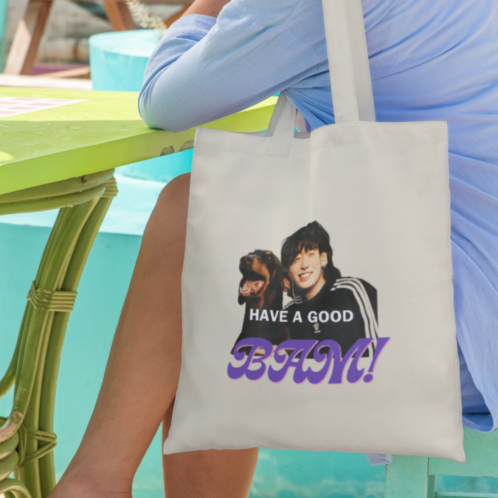 Woman-sitting-on-chair-next-to-table-with-canvas-totebag-JK-BAM