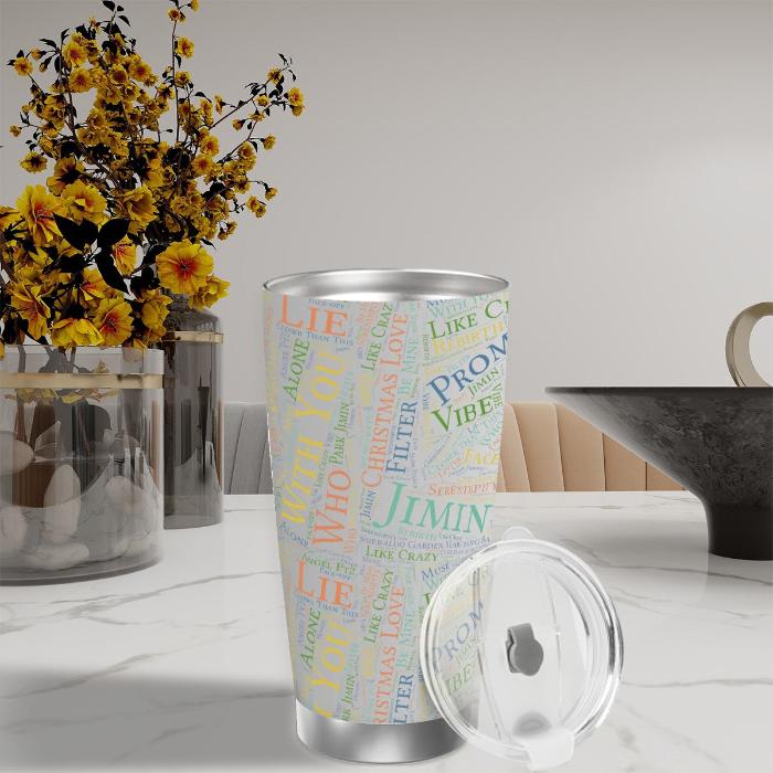 Jimin discography insulated tumbler with lid at a table