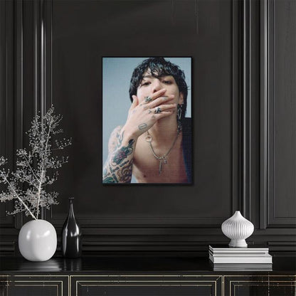 Wall art of a diamond painting with Jungkook on wall in livingroom with sidetable 