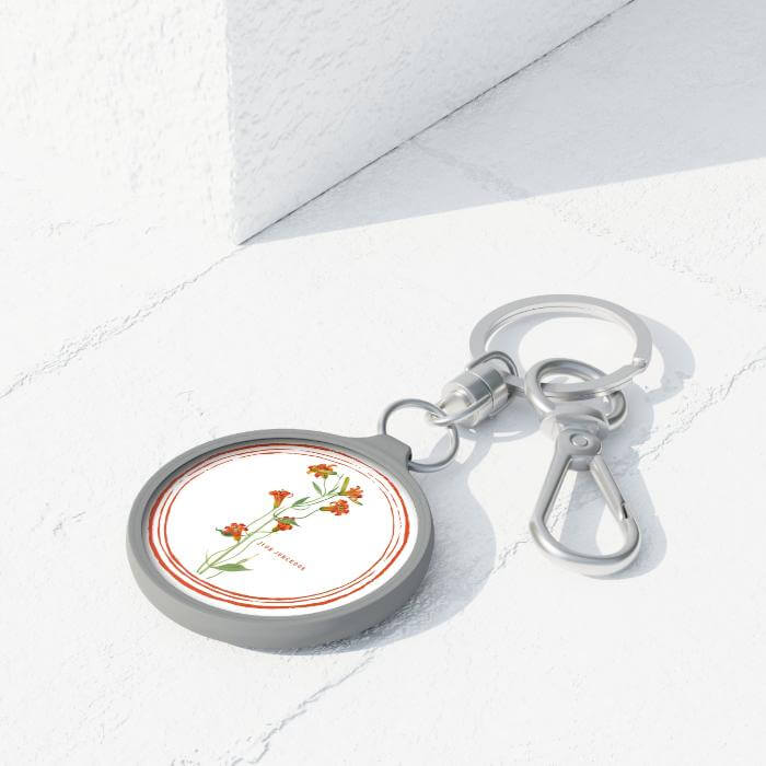 Keychain birthflower JK keychain on a concrete background