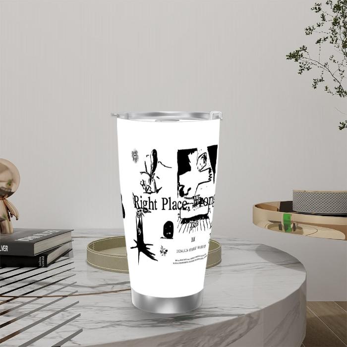 White insulated stainless steel travel tumbler RPWP RM of BTS newest album on a table