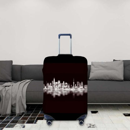 Black travel suitcase cover with a seoul skyline design in a livingroom