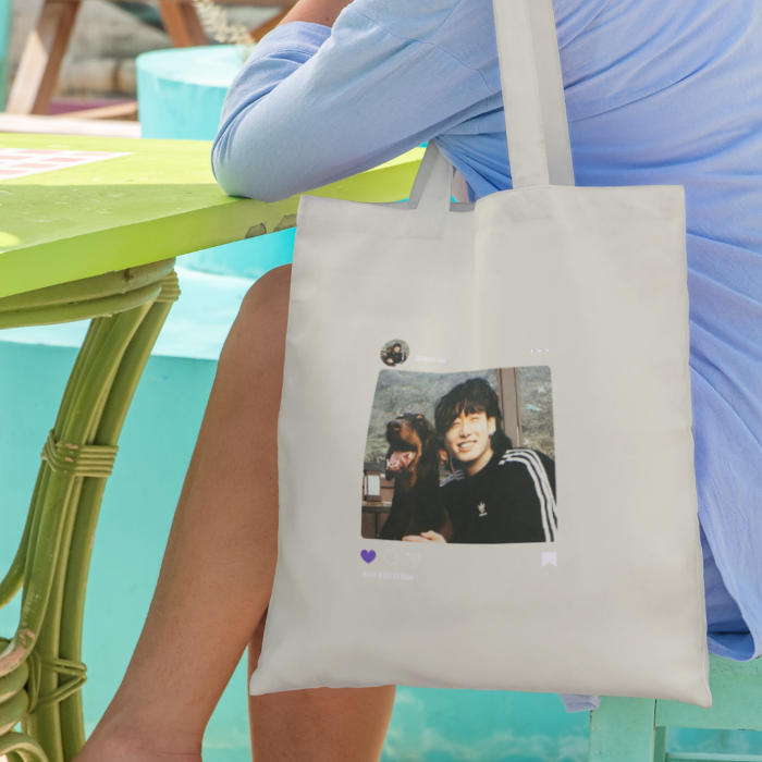 Young woman sitting on chair with a canvas totebag BAM JK design instagram summervibe