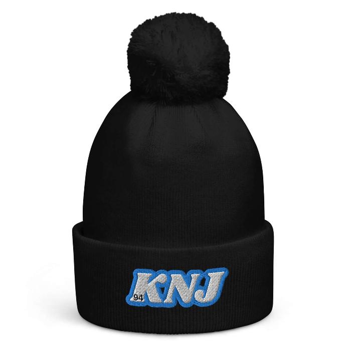 Black pom pom beanie with "KNJ" initials, inspired by RM of BTS, perfect for staying warm and stylish in kpop fashion.