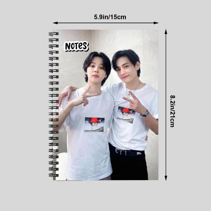 Frontside of a notebook with picture jimin and taehyung holding peace sign