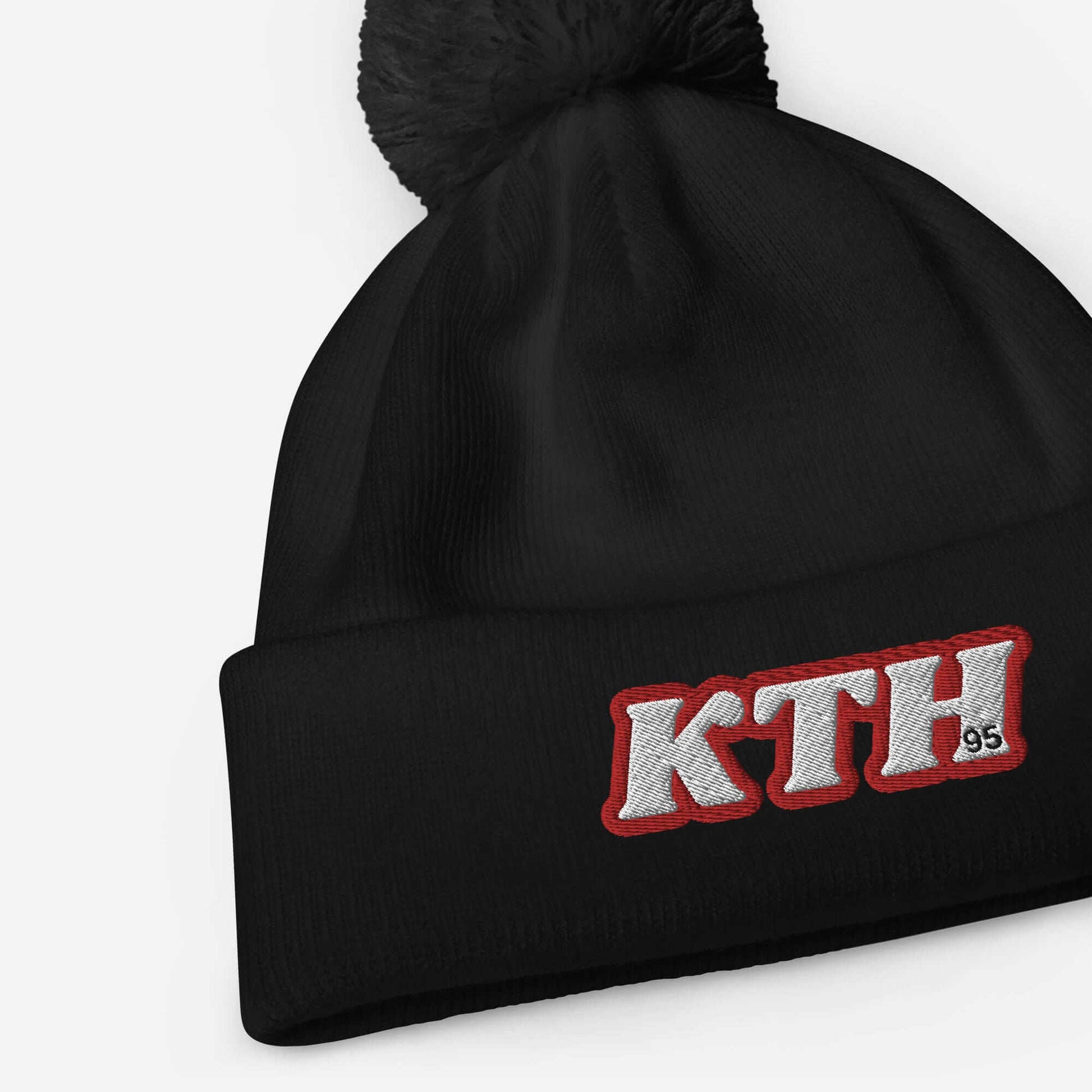 Black pom pom beanie with "KTH" embroidery, inspired by Taehyung V of BTS, perfect for adding charisma and warmth in winter.