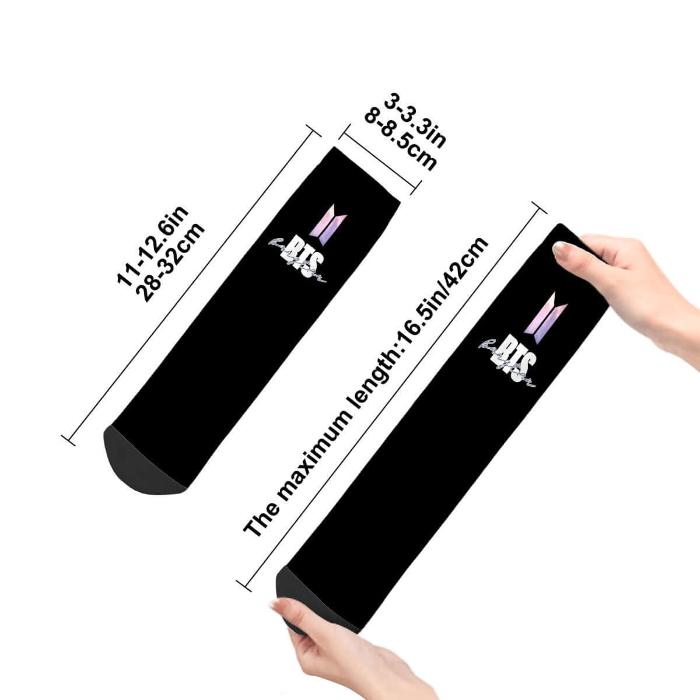 Black BTS tube socks with logo, hand-held, showing dimensions; 11-12.6in length, perfect fan accessory.