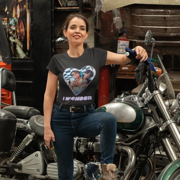 Woman standing proudly next to motorcyle wearing JK J-hope I wonder t-shirt