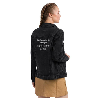  back of black denim jacket: BTS Bangtan logo on front, “Until the spring day comes again June 2025” on back, worn by a woman.